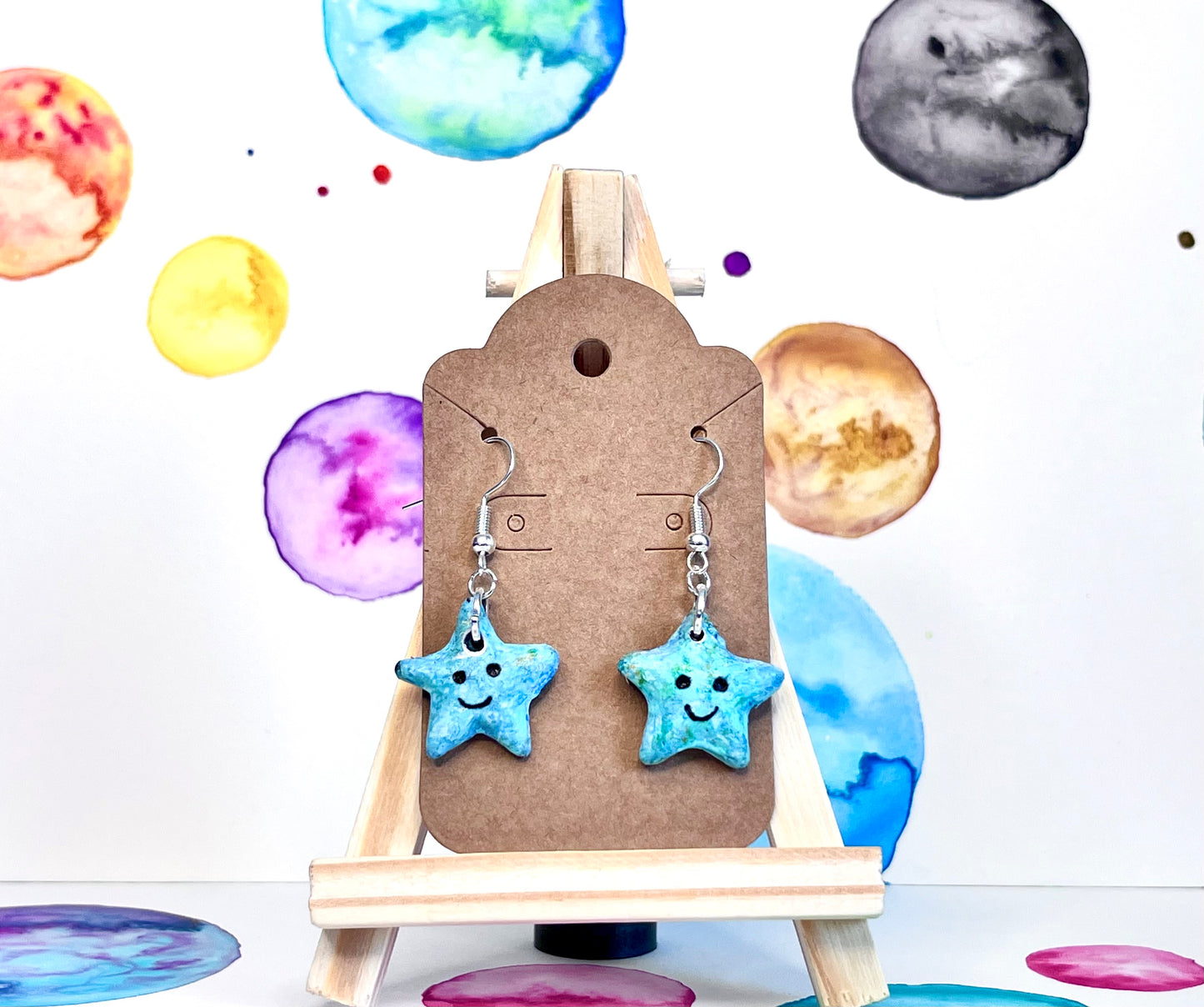 Light blue star earrings